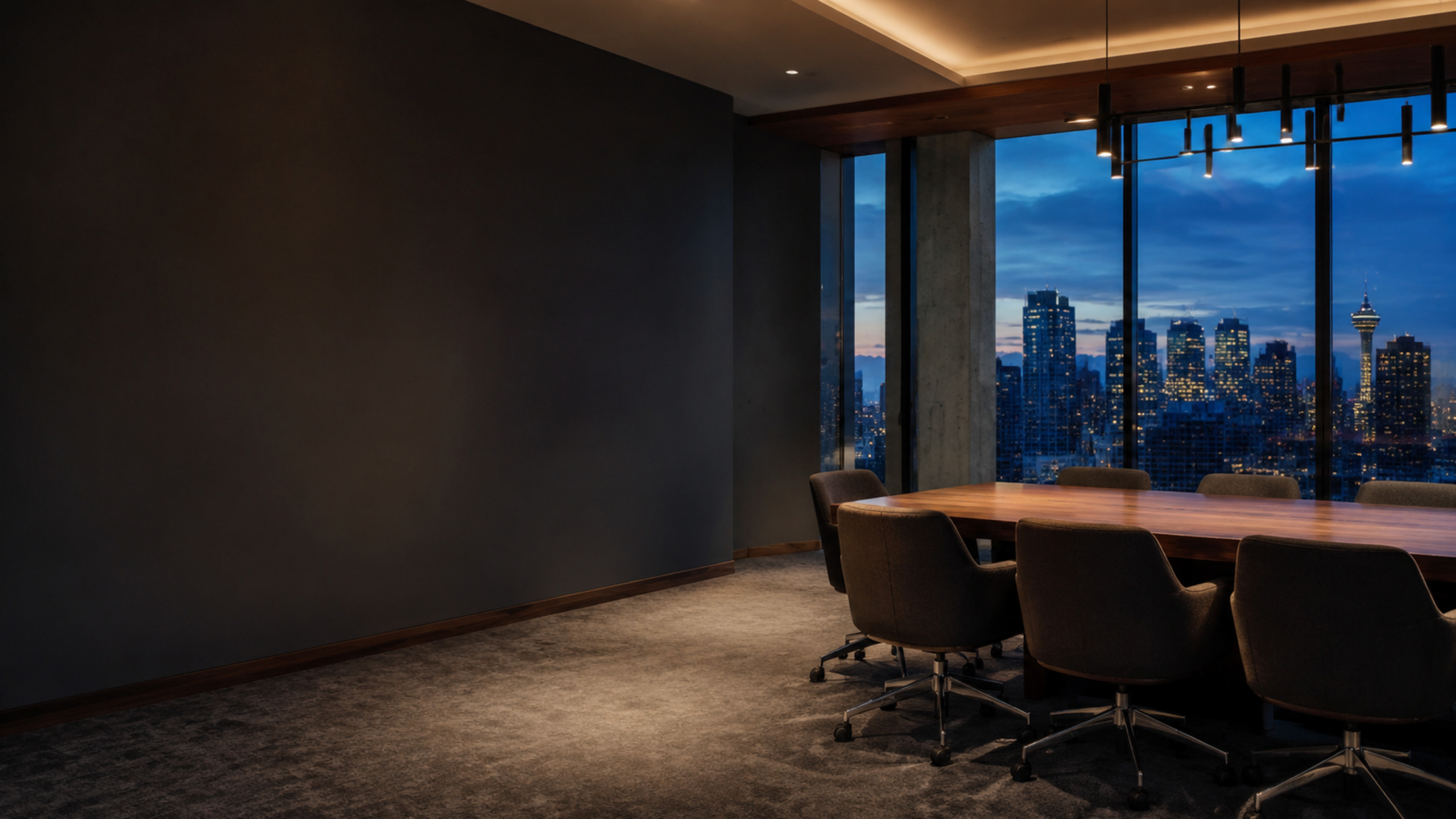 Contemporary Calgary boardroom overlooking the city at blue hour